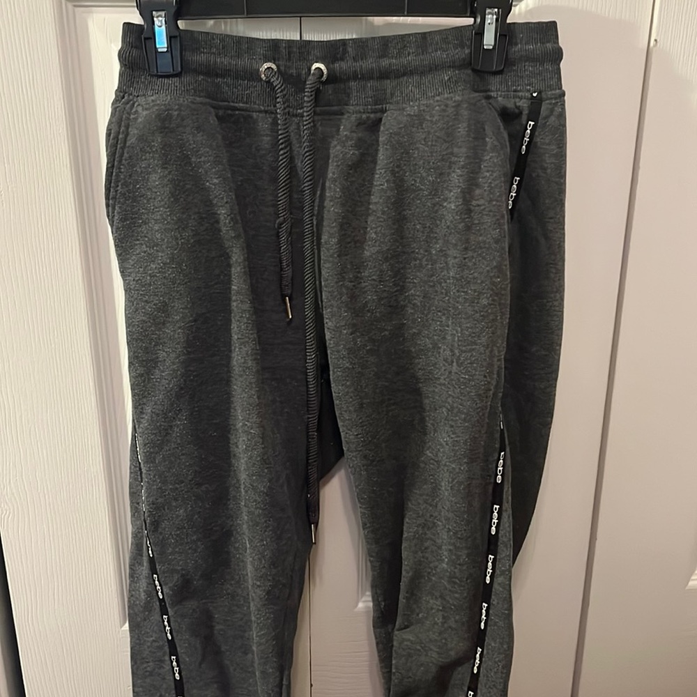 grey sweatpants with logo “bebe” down legs